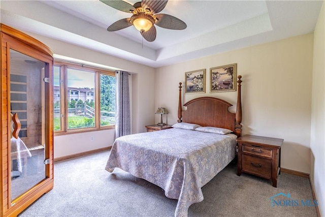 6666 Brick Yard Ct, Maumee, OH 43537 - carpeted bedroom with ceiling fan and a tray ceiling