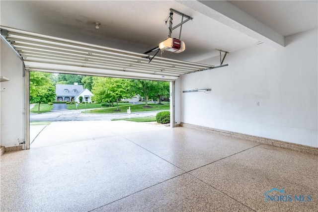 6666 Brick Yard Ct, Maumee, OH 43537 - garage featuring a garage door opener and baseboards