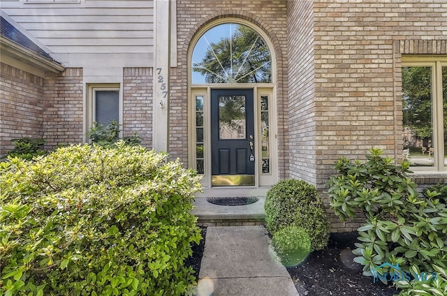 7257 Wembley Ter, Toledo, OH 43617 - doorway to property with brick siding