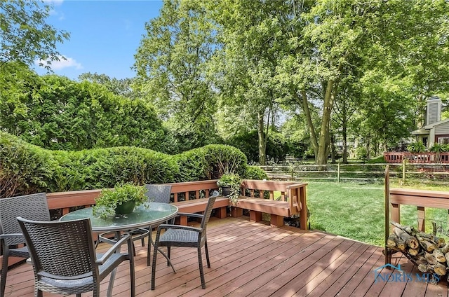 7257 Wembley Ter, Toledo, OH 43617 - wooden terrace with outdoor dining area and view of scattered trees