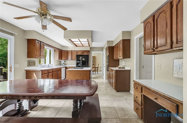 7257 Wembley Ter, Toledo, OH 43617 - kitchen with black refrigerator with ice dispenser, dishwasher, light countertops, and a ceiling fan