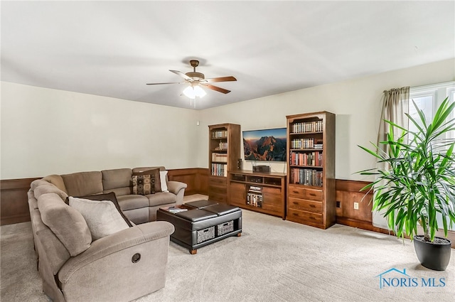 7257 Wembley Ter, Toledo, OH 43617 - living area featuring carpet, wainscoting, and ceiling fan