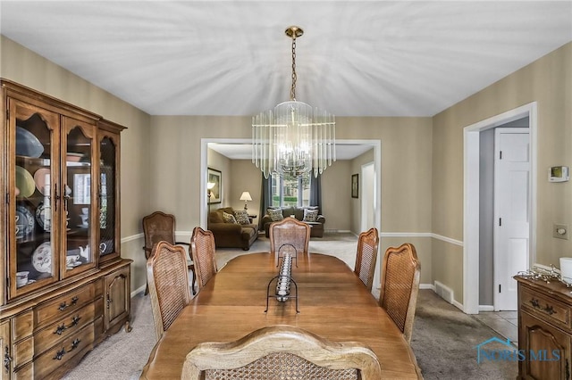 7257 Wembley Ter, Toledo, OH 43617 - dining room with a chandelier and light carpet