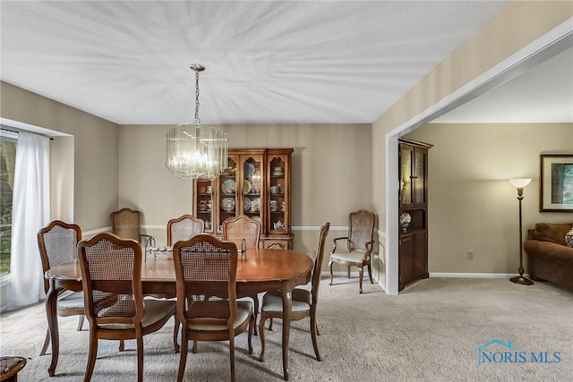 7257 Wembley Ter, Toledo, OH 43617 - dining area with a chandelier and light colored carpet