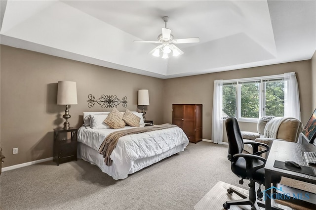 7257 Wembley Ter, Toledo, OH 43617 - bedroom featuring a raised ceiling, light colored carpet, a desk, and a ceiling fan