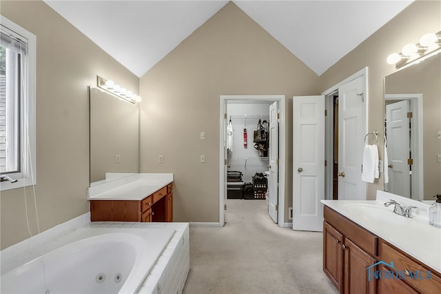 7257 Wembley Ter, Toledo, OH 43617 - full bathroom featuring vanity, a tub with jets, and vaulted ceiling