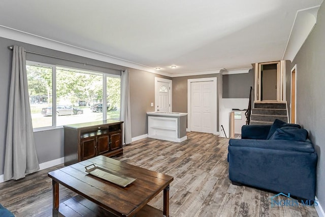 2338 Greenlawn Dr, Toledo, OH 43614 - living area featuring wood finished floors, crown molding, and stairway