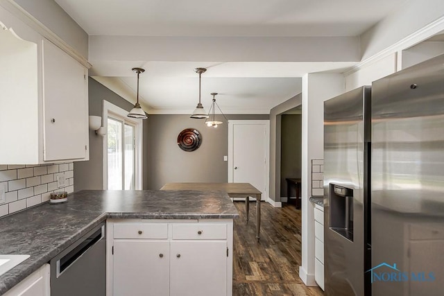 2338 Greenlawn Dr, Toledo, OH 43614 - kitchen featuring appliances with stainless steel finishes, a peninsula, white cabinetry, and dark wood-style flooring