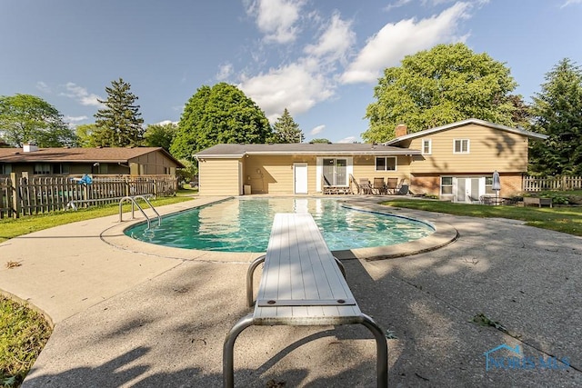 2338 Greenlawn Dr, Toledo, OH 43614 - view of swimming pool featuring a patio and a diving board