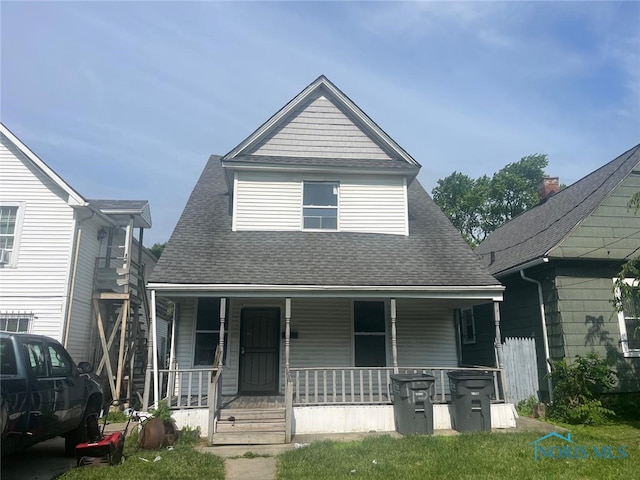 1131 Montrose Ave, Toledo, OH 43607 - view of front of home featuring covered porch and a shingled roof