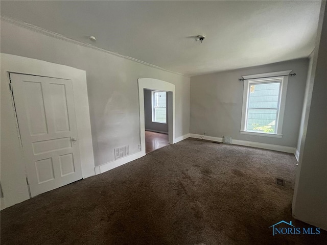 1131 Montrose Ave, Toledo, OH 43607 - carpeted spare room with arched walkways and ornamental molding