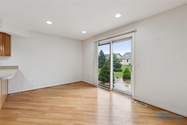 26332 Whitewater Dr, Perrysburg, OH 43551 - unfurnished living room with light wood finished floors and recessed lighting