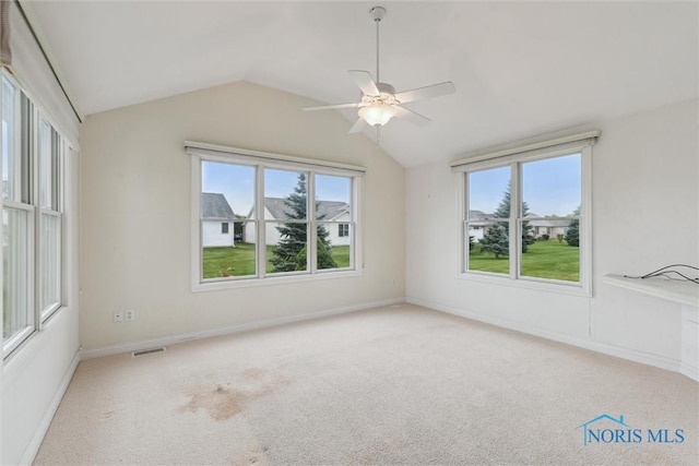 26332 Whitewater Dr, Perrysburg, OH 43551 - carpeted empty room with healthy amount of natural light, lofted ceiling, and a ceiling fan
