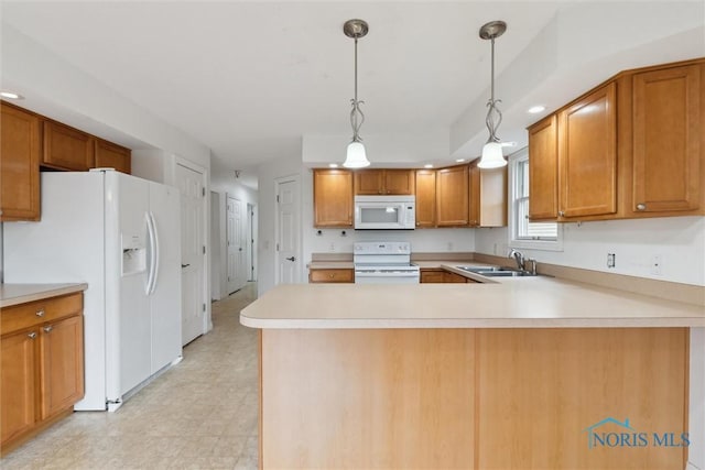 26332 Whitewater Dr, Perrysburg, OH 43551 - kitchen with white appliances, light countertops, a peninsula, decorative light fixtures, and brown cabinetry