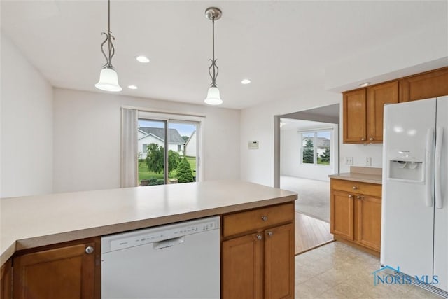 26332 Whitewater Dr, Perrysburg, OH 43551 - kitchen featuring white appliances, brown cabinetry, plenty of natural light, hanging light fixtures, and recessed lighting