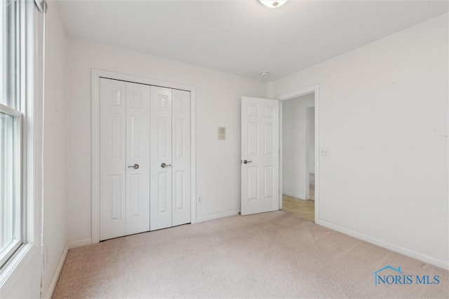 26332 Whitewater Dr, Perrysburg, OH 43551 - unfurnished bedroom featuring light colored carpet and a closet