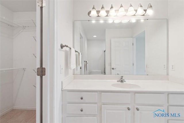 26332 Whitewater Dr, Perrysburg, OH 43551 - bathroom featuring vanity and a walk in closet