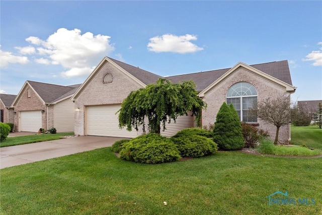 26332 Whitewater Dr, Perrysburg, OH 43551 - single story home featuring brick siding, concrete driveway, an attached garage, and a front lawn