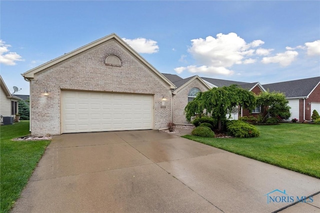 26332 Whitewater Dr, Perrysburg, OH 43551 - ranch-style house with brick siding, a front lawn, concrete driveway, and an attached garage