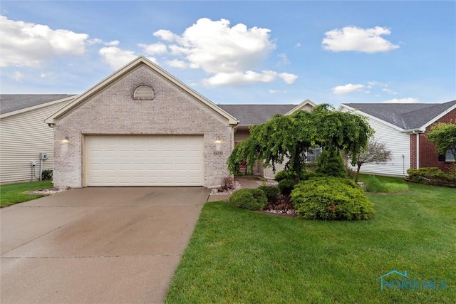 26332 Whitewater Dr, Perrysburg, OH 43551 - single story home featuring brick siding, concrete driveway, and a front yard