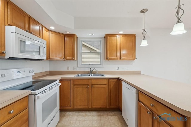 26332 Whitewater Dr, Perrysburg, OH 43551 - kitchen with white appliances, brown cabinetry, light countertops, and recessed lighting