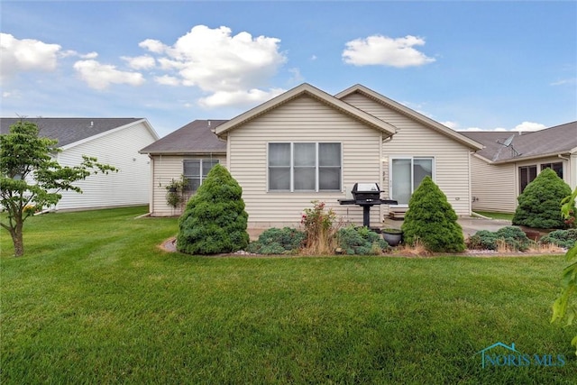 26332 Whitewater Dr, Perrysburg, OH 43551 - rear view of property with a lawn and a patio area
