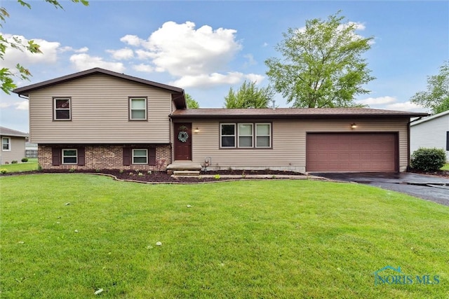 824 Edgehill Rd, Findlay, OH 45840 - split level home featuring driveway, a garage, and a front lawn
