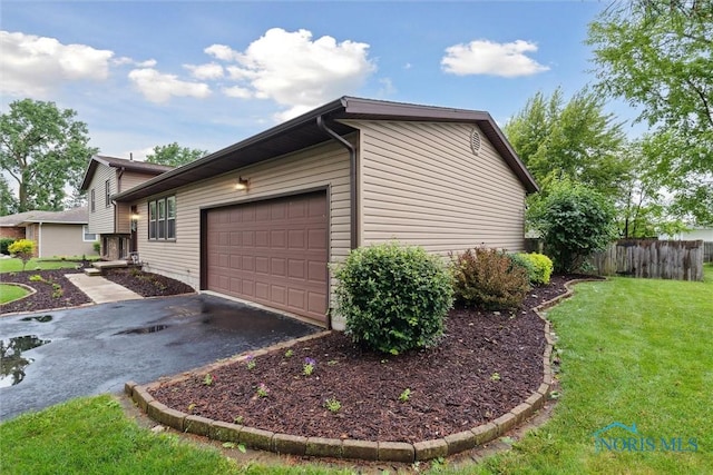 824 Edgehill Rd, Findlay, OH 45840 - view of property exterior featuring a garage and driveway