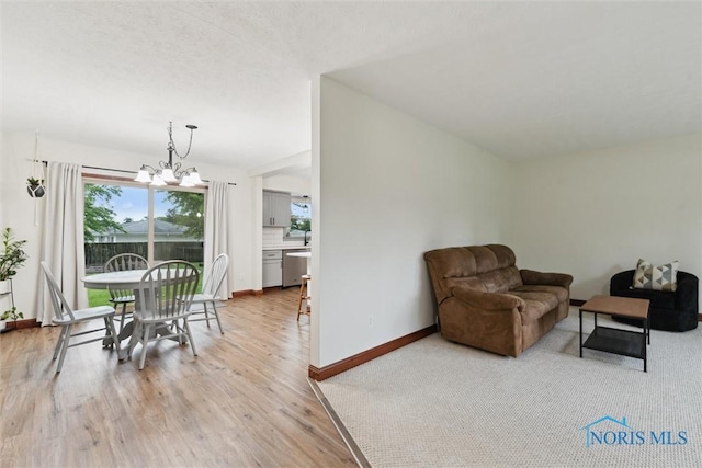 824 Edgehill Rd, Findlay, OH 45840 - dining area with a chandelier and light wood-style floors
