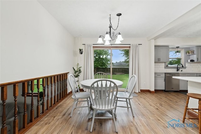 824 Edgehill Rd, Findlay, OH 45840 - dining space with a chandelier and light wood-style floors