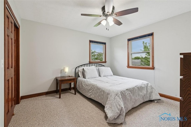824 Edgehill Rd, Findlay, OH 45840 - bedroom with light carpet, a ceiling fan, and a closet