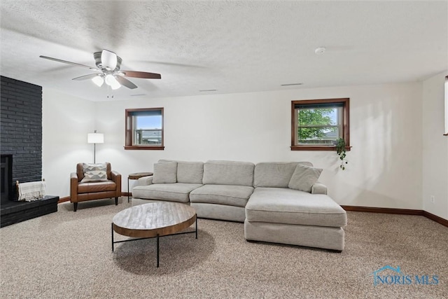 824 Edgehill Rd, Findlay, OH 45840 - carpeted living room featuring ceiling fan and a brick fireplace