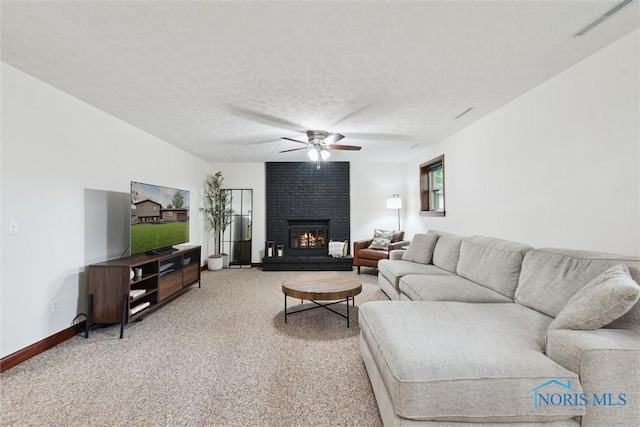 824 Edgehill Rd, Findlay, OH 45840 - living area featuring ceiling fan, light carpet, a brick fireplace, and a textured ceiling