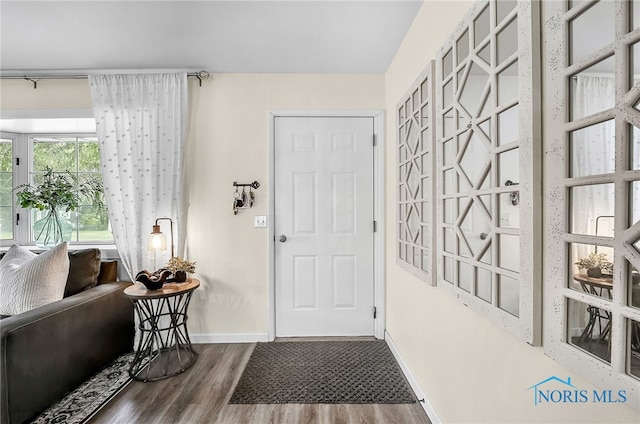 550 W 2nd St, Perrysburg, OH 43551 - foyer entrance featuring wood finished floors and baseboards