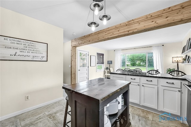 550 W 2nd St, Perrysburg, OH 43551 - kitchen with open shelves, white cabinetry, beam ceiling, and butcher block counters