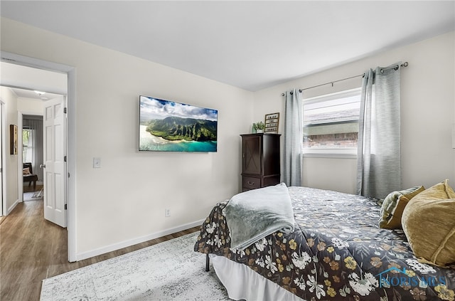 550 W 2nd St, Perrysburg, OH 43551 - bedroom with wood finished floors and baseboards