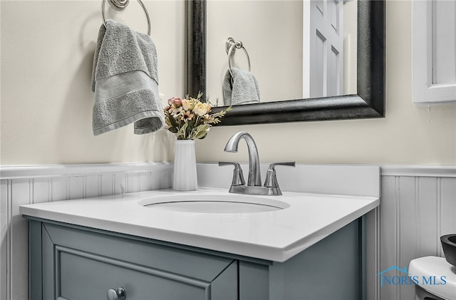 550 W 2nd St, Perrysburg, OH 43551 - bathroom featuring vanity and wainscoting
