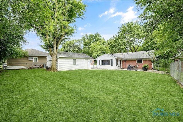 550 W 2nd St, Perrysburg, OH 43551 - back of property with a patio and a fenced backyard