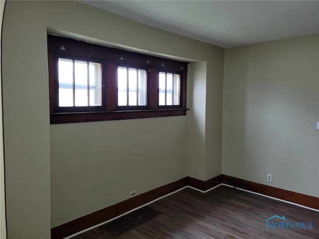 728 Ashwood Ave, Toledo, OH 43608 - spare room with healthy amount of natural light and dark wood-style floors
