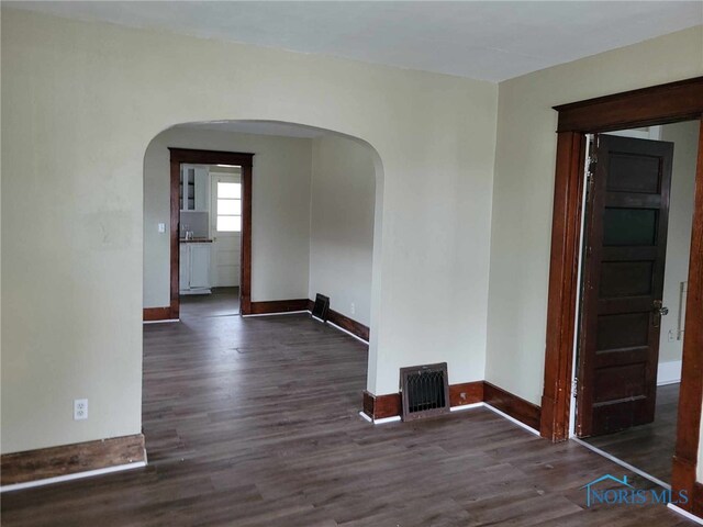 728 Ashwood Ave, Toledo, OH 43608 - spare room with arched walkways and wood finished floors