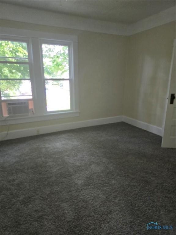1019 Wayne Ave, Defiance, OH 43512 - empty room featuring dark carpet and cooling unit