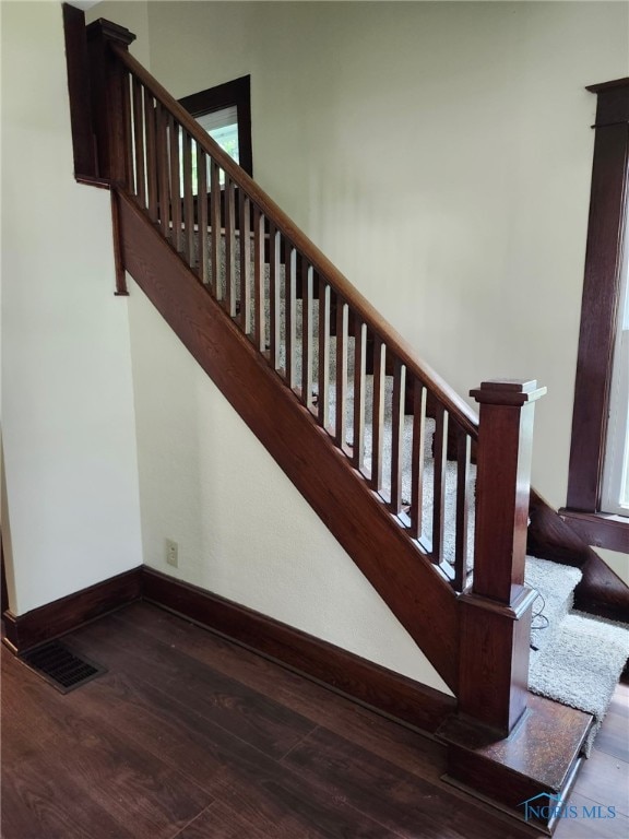 1019 Wayne Ave, Defiance, OH 43512 - stairs featuring wood finished floors and baseboards