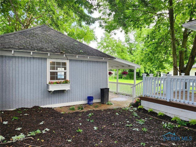 1019 Wayne Ave, Defiance, OH 43512 - view of home's exterior featuring roof with shingles and a deck
