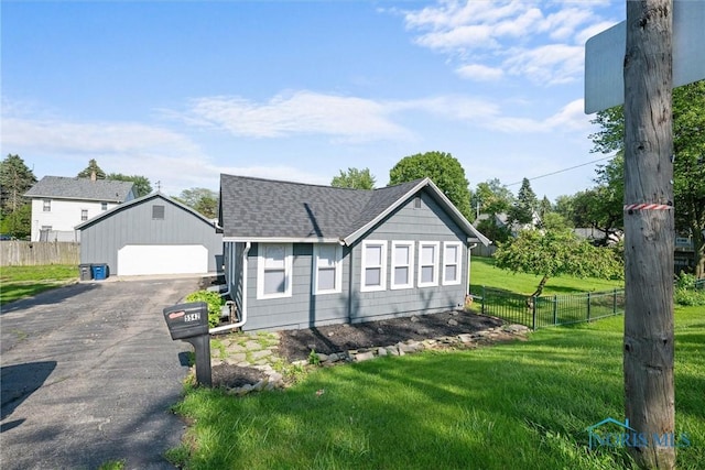 5542 N Summit St, Toledo, OH 43611 - ranch-style home featuring a detached garage, an outdoor structure, and a shingled roof