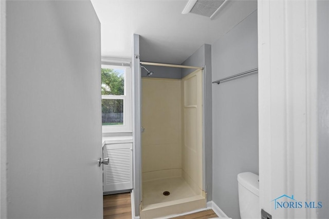 5542 N Summit St, Toledo, OH 43611 - bathroom with a stall shower and wood finished floors