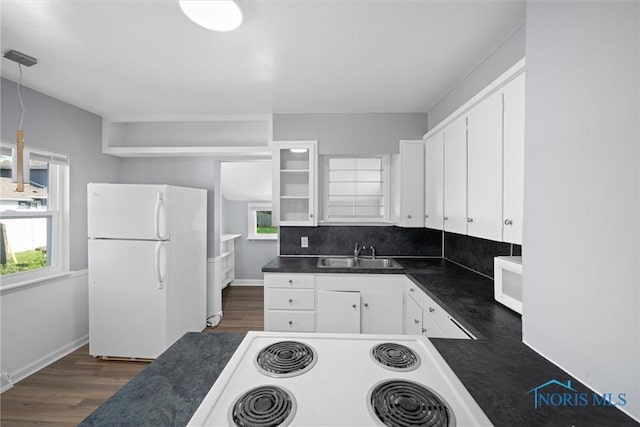 5542 N Summit St, Toledo, OH 43611 - kitchen with white appliances, dark countertops, and plenty of natural light