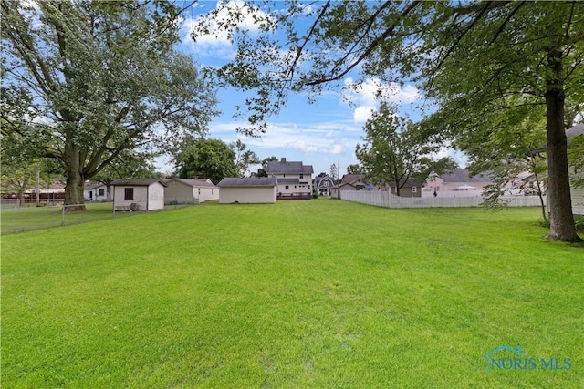 125 Cherry St, Wauseon, OH 43567 - view of yard featuring a storage unit