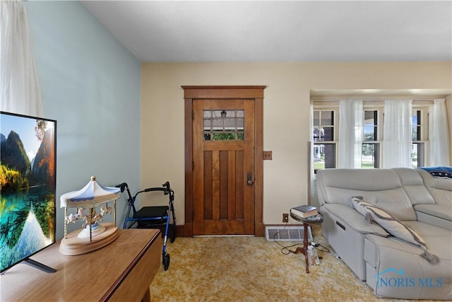 125 Cherry St, Wauseon, OH 43567 - foyer with carpet flooring