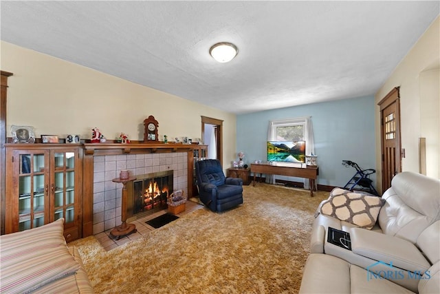 125 Cherry St, Wauseon, OH 43567 - carpeted living room featuring a fireplace