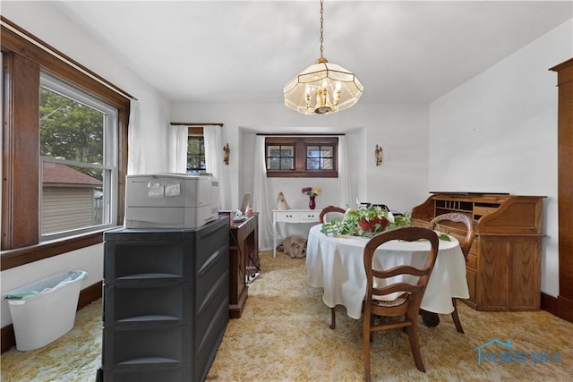 125 Cherry St, Wauseon, OH 43567 - dining room featuring a chandelier and baseboards